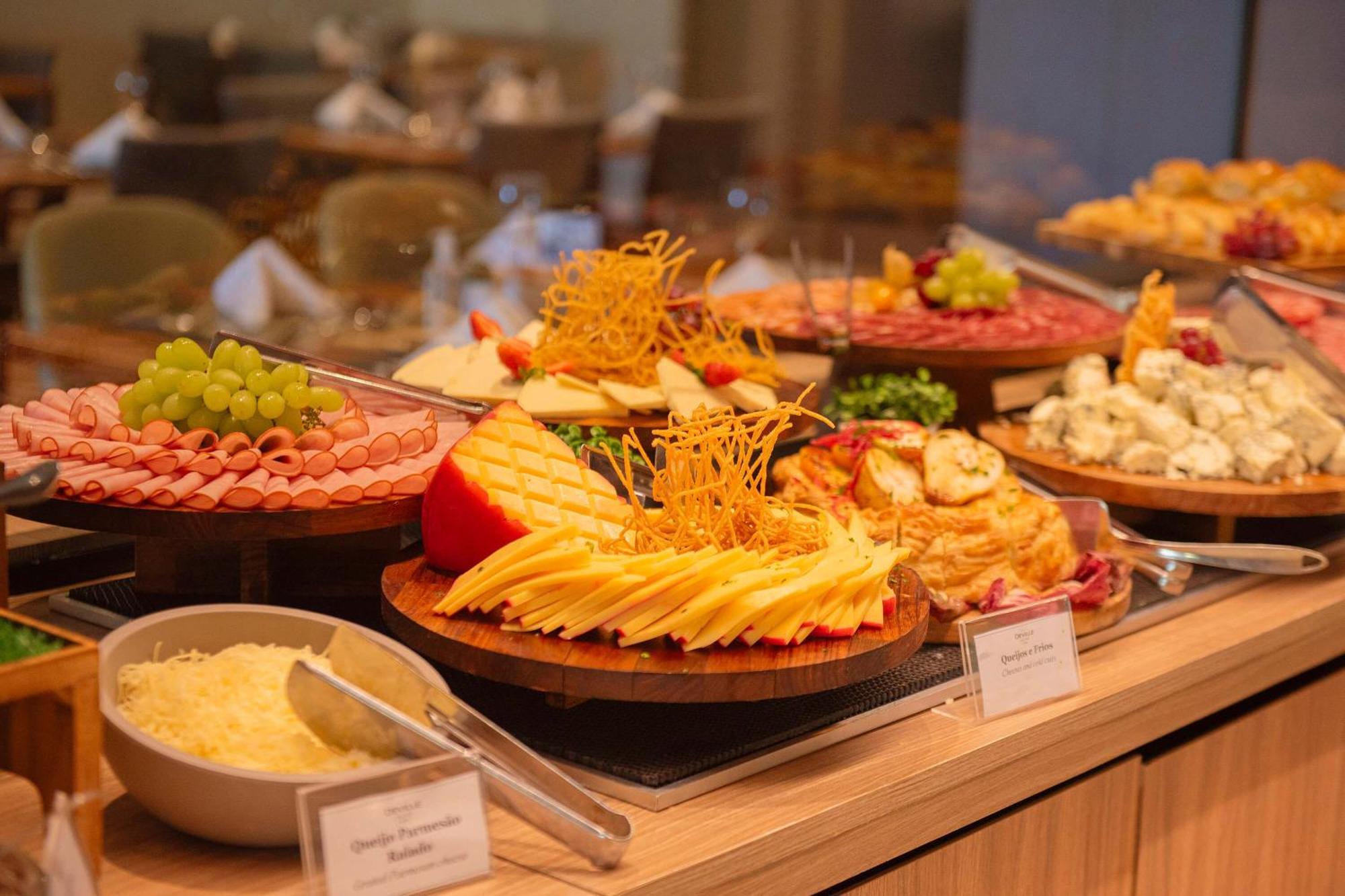 Hotel Deville Prime Salvador Bagian luar foto A cheese platter