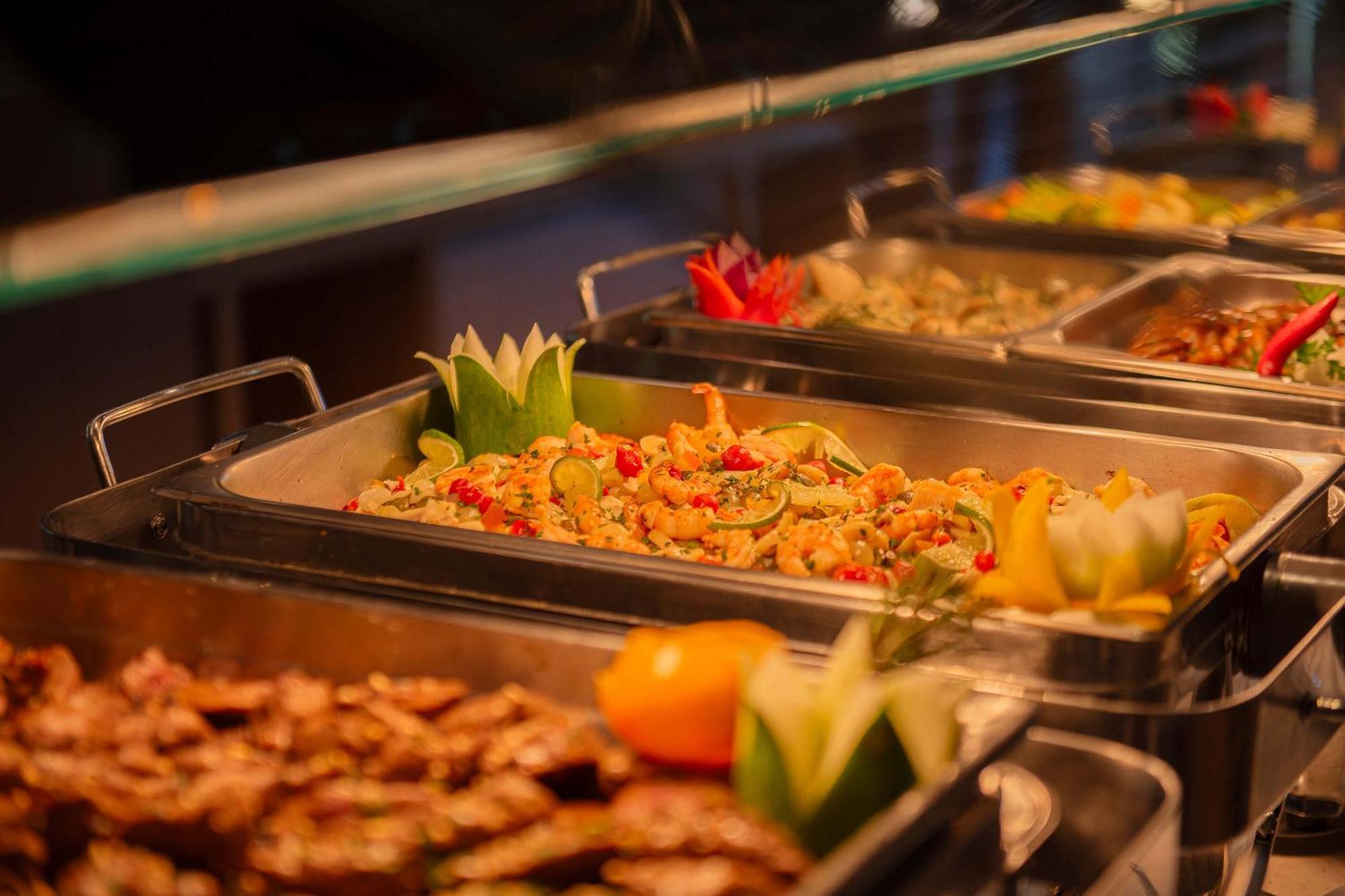 Hotel Deville Prime Salvador Bagian luar foto A chafing dish
