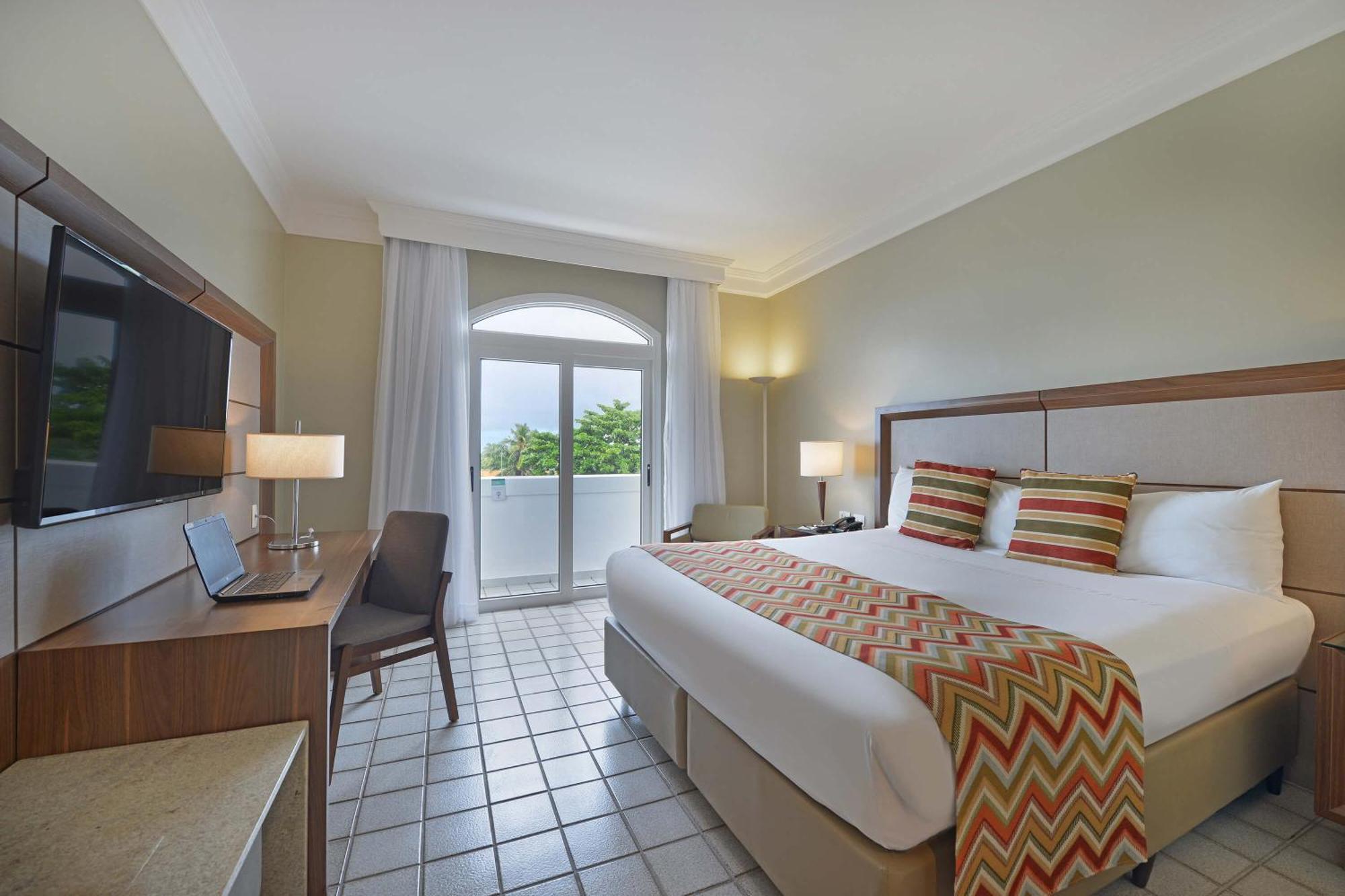 Hotel Deville Prime Salvador Bagian luar foto A room at the hotel