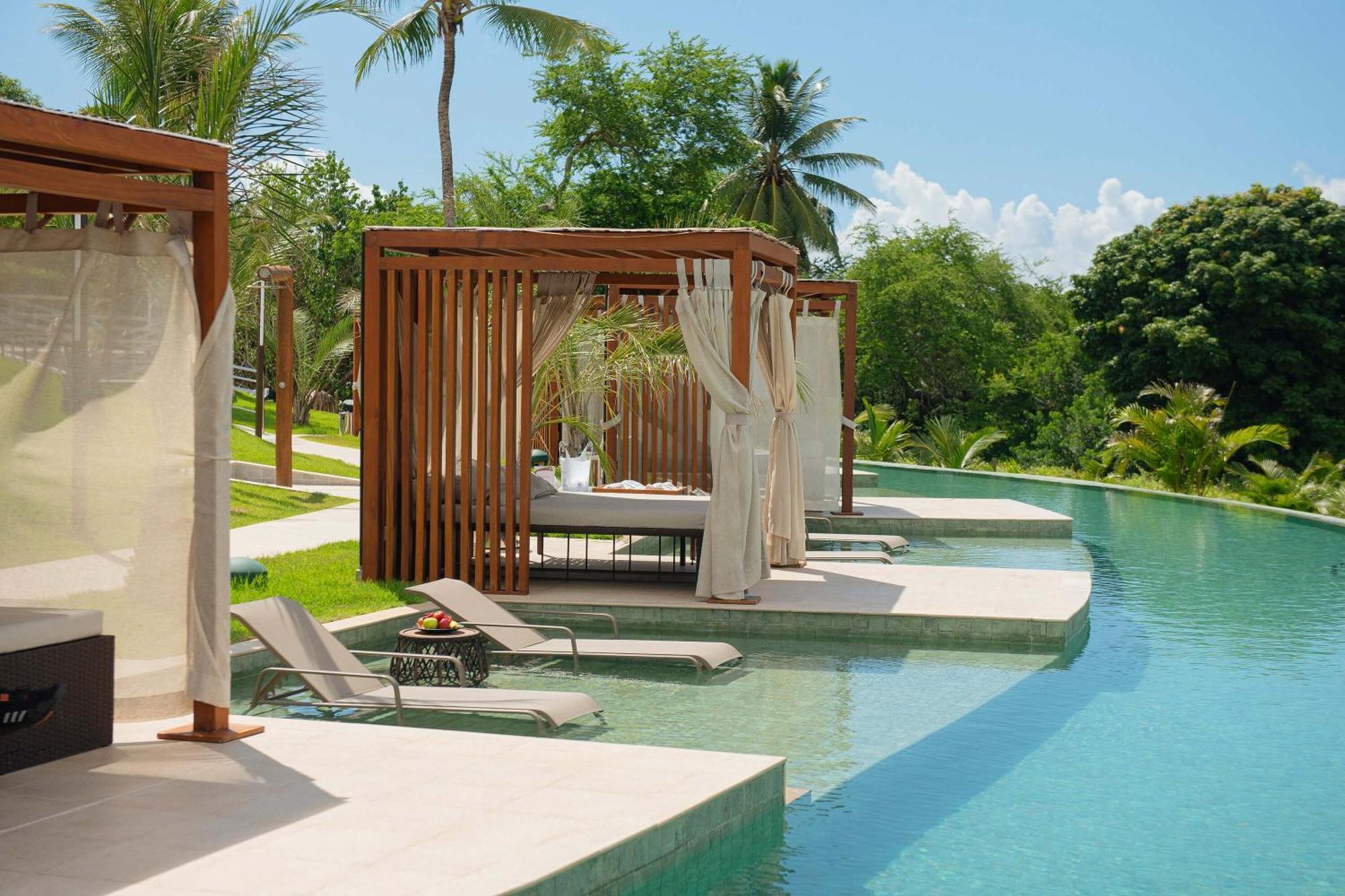 Hotel Deville Prime Salvador Bagian luar foto The swimming pool at the resort