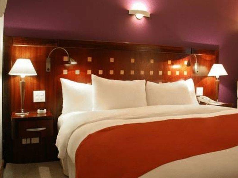 Hotel Deville Prime Salvador Bagian luar foto A typical room at the hotel